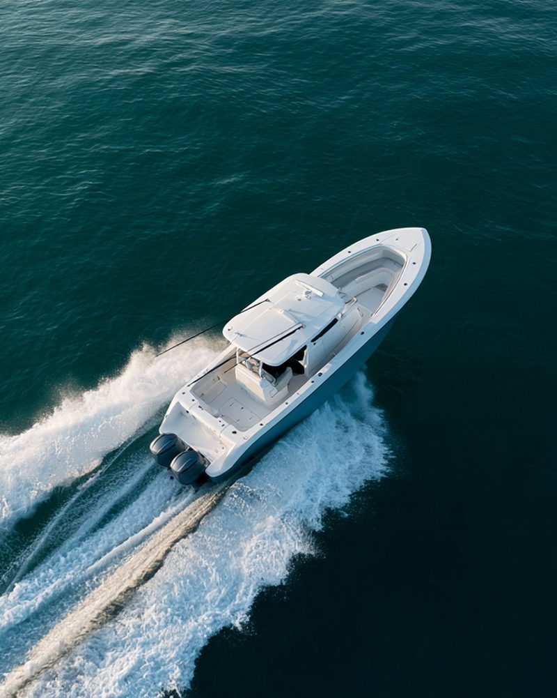 Aerial view of a powerboat turning across open water